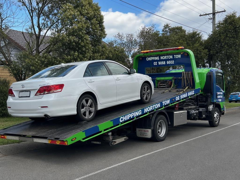 Car loaded on a Chipping Norton Tow flatbed tow truck