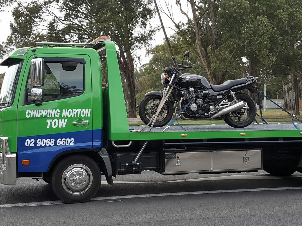 Motorbike strapped to a Chipping Norton Tow truck deck